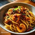 A tempting bowl of Marry Me Shrimp Pasta with juicy shrimp, sun-dried tomatoes, and fresh basil.