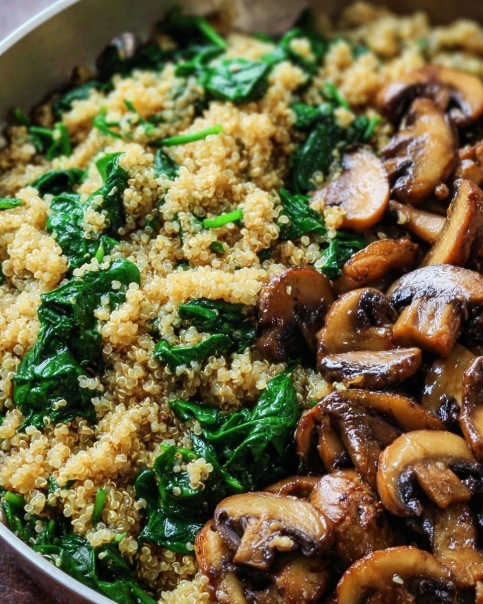 Close-up of a Spinach Mushroom Quinoa Skillet, featuring quinoa, spinach, and sauteed mushrooms.