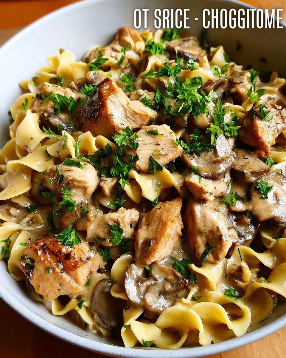 Close-up of creamy chicken and mushroom stroganoff served over egg noodles, perfect for 30-Minute Family Dinners.