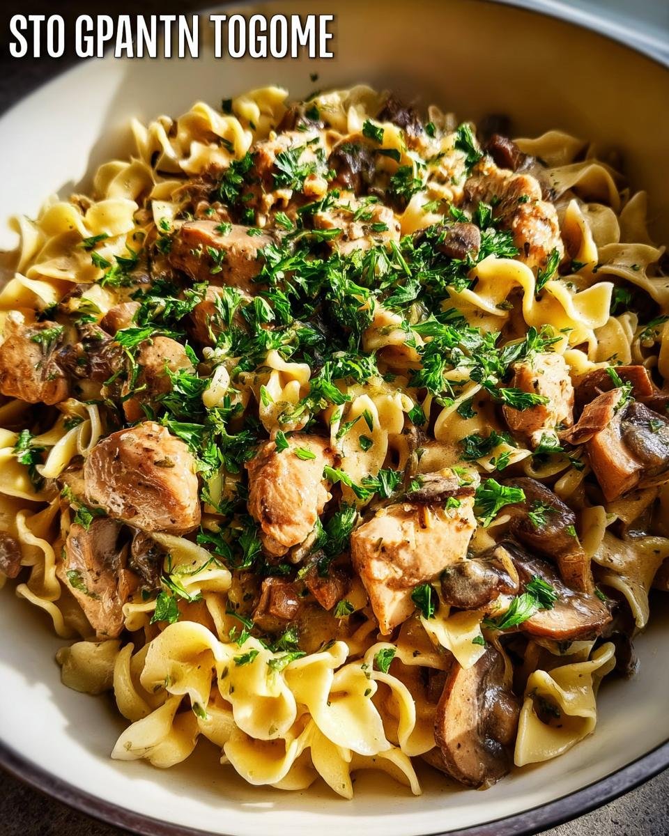 A bowl of creamy chicken and mushroom pasta topped with fresh parsley, perfect for 30-Minute Family Dinners.