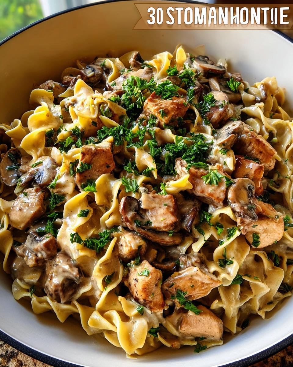 Close-up of creamy chicken and mushroom pasta with egg noodles, perfect for 30-Minute Family Dinners.