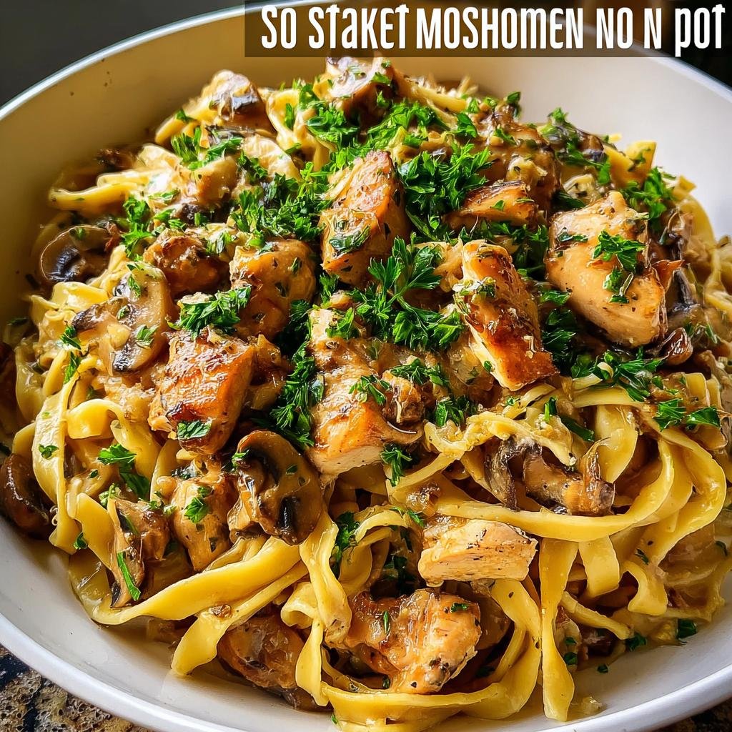 A bowl of creamy chicken and mushroom pasta topped generously with fresh parsley, perfect for 30-Minute Family Dinners.